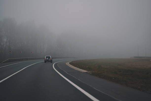 istock Autumn thick fog on the highway 1432710905