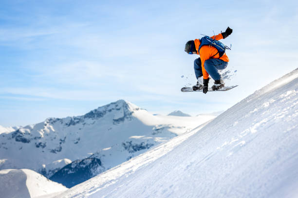 Man skier in action in backcountry area with fresh powder snow at Whistler-Blackcomb Ski Resort stock photo