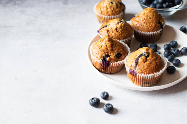istock Blueberry muffins served in a plate on a marble background. Copy space. 1432712966