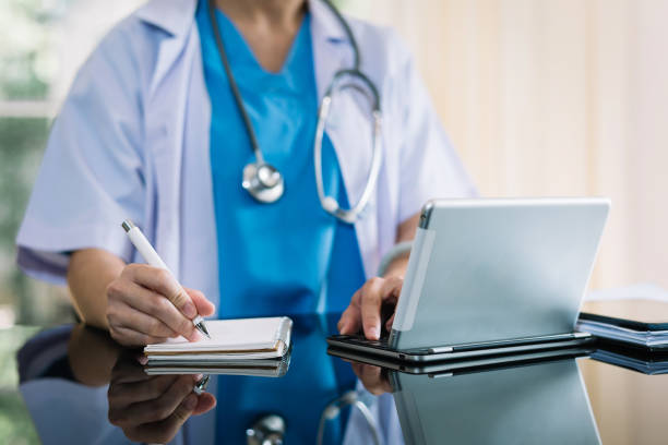 istock Medical technology concept. Doctor working with mobile phone and stethoscope in modern office 1432713414