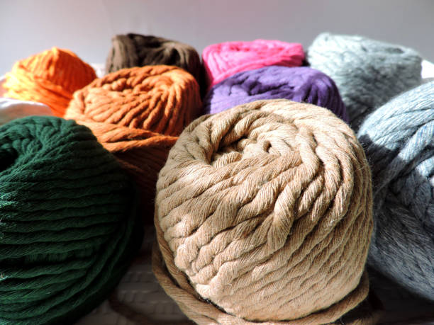 istock Roll of cotton thread on a white background. Handcrafted materials. Ingredients for macrame. 1432716241