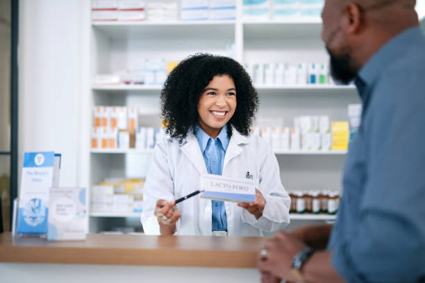 istock Customer, pharmacist and consulting about medicine and getting help in pharmacy with prescription medication. Medical healthcare professional helping, talking and selling box of drugstore pills 1432720070