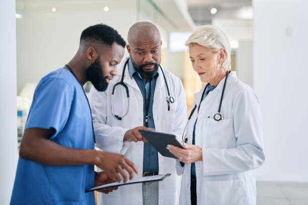 istock Diversity, teamwork and doctors in collaboration planning a medical surgery strategy report or review in a hospital. Healthcare workers in a meeting talking about treatment and diagnosis in New York 1432720144