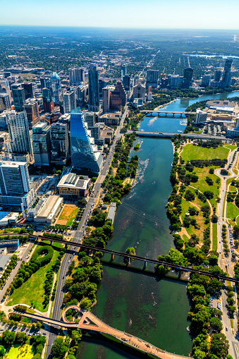 Aerial view of the buildings along the banks of the Colorado River in downtown Austin, Texas from about 2000 feet in altitude during a helicopter photo flight.