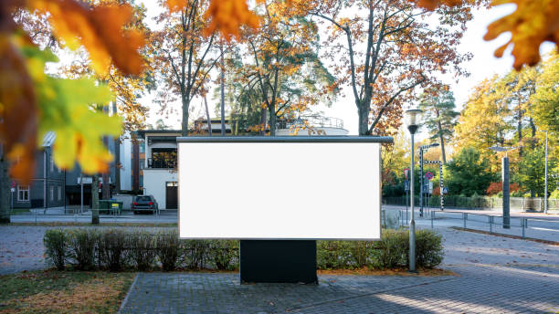 istock Big empty white billboard with mock up space mounted at urban street 1432725013