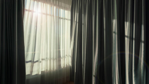 istock Sunlight illuminate empty room through transparent curtain 1432725036