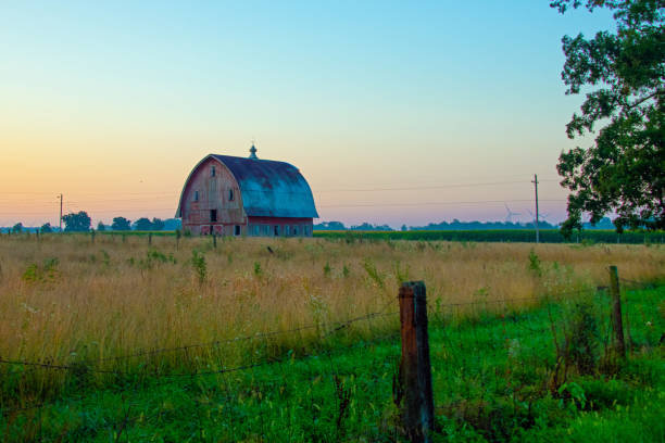 istock Old weathered Red Barn at sunrise-Howard County, Indiana 1432728934