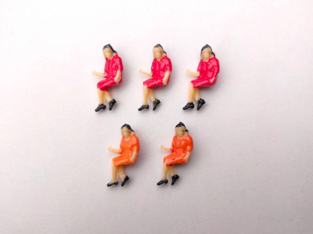 istock Miniature people are neatly arranged on a white background. 1432729041