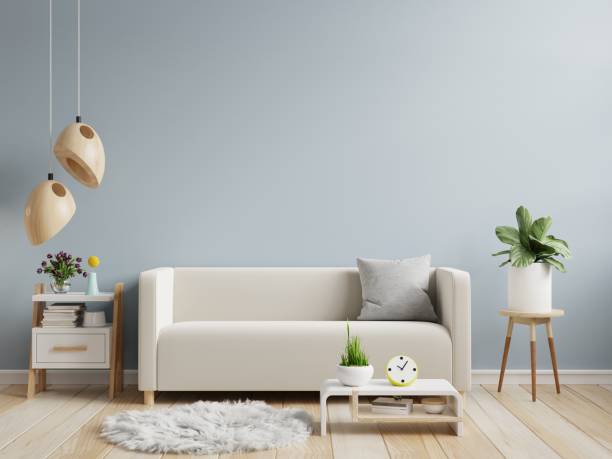 istock Light blue wall mock up in warm tones with cream color sofa and decoration minimal. 1432732466