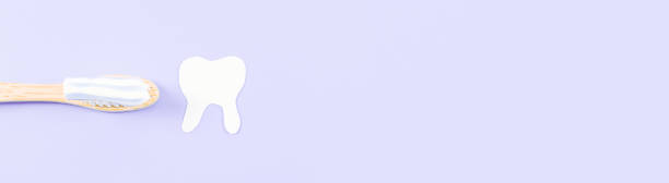 istock Bamboo toothbrush with toothpaste and paper tooth on the right against a soft lilac 1432733507