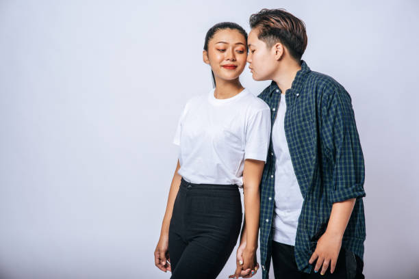 istock Two loving women standing and holding hands. 1432736833