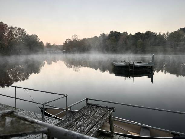 A foggy lake at sunrise in southeast Ohio stock photo
