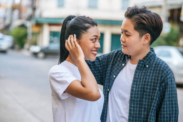 istock Couple women standing and looking at each other. 1432742700