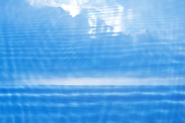 istock Defocus blurred transparent blue colored clear calm water surface texture with splash, bubble. Shining blue water ripple background. Surface of water in swimming pool. Blue bubble water shining. 1432742796