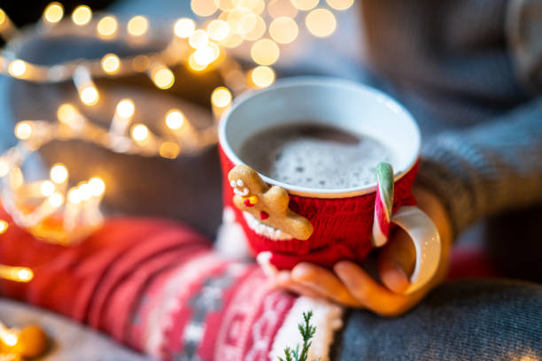 istock One hand holding a hot drink at Christmas 1432747003