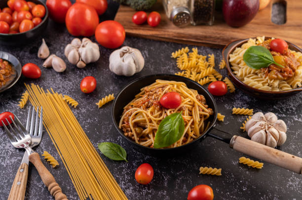 istock Spaghetti sauteed in a pan-fried with tomatoes and basil 1432748760