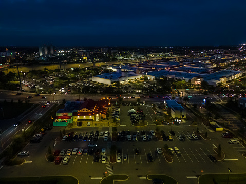 Amazing aerial view of an amusement park in Orlando Florida at night with the big roller coaster
