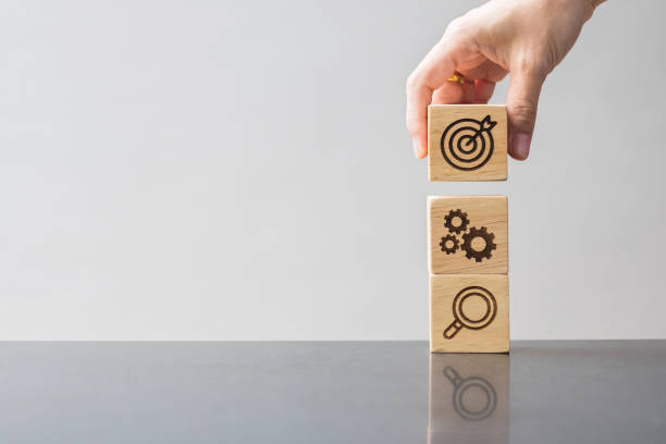 istock wood block with business goal, strategy, target, mission, action, objective, teamwork, brainstorm and idea concept 1432758624