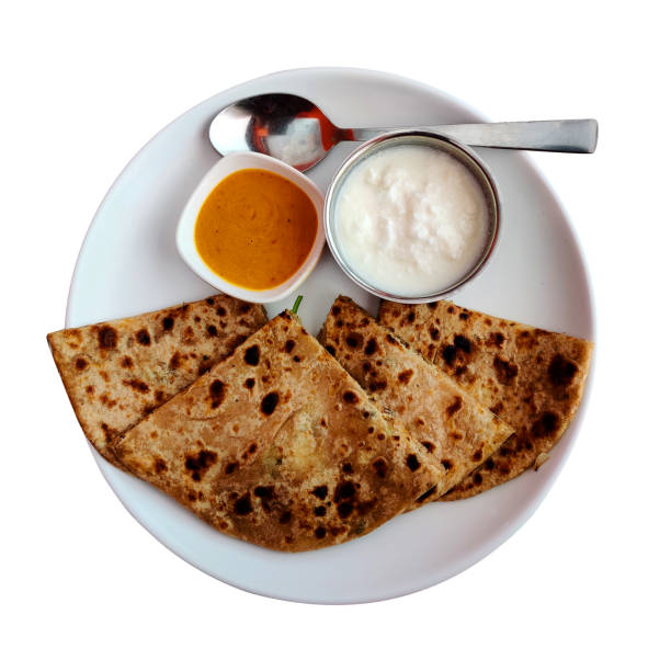 istock Aloo paratha or potato stuffed flat bread. Served with curd and sauce. Breakfast and evening snacks. 1432760279