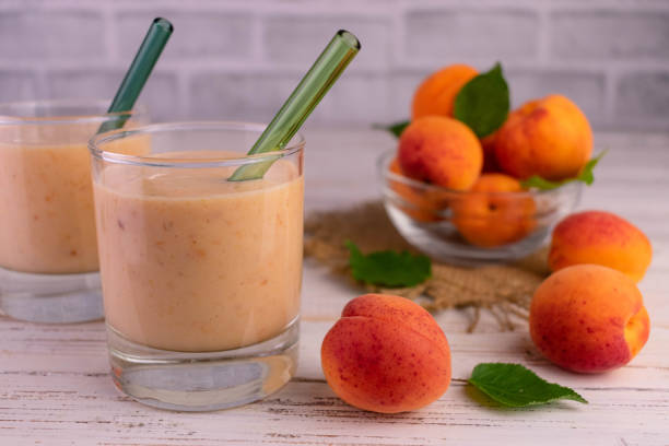 istock Two glasses with apricot smoothie.Close-up. 1432761486