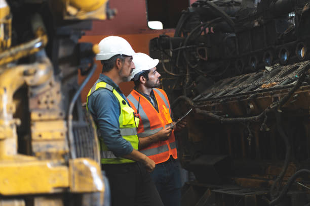 istock professional technician engineer with safety helmet hard hat working in industrial manufacturing factory, men at work to checking equipment of machinery production technology or construction operating 1432762311