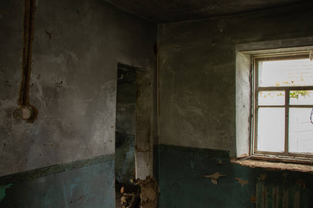 istock old abandoned one-story building dark without windows and doors, destroyed building 1432763558