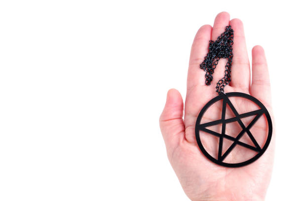 Black pentagram in hand isolated on white