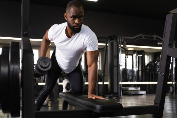 istock Fit and muscular african man trains with dumbbells. 1432767587