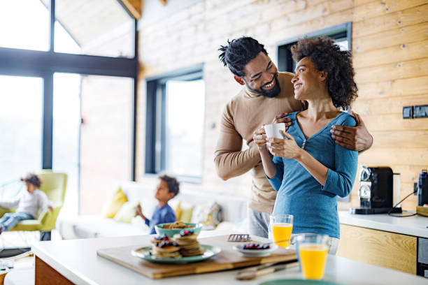 istock Happy black parents talking during morning time at home. 1432773149