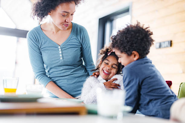 istock Happy black kids having fun during breakfast time in dining room. 1432773226