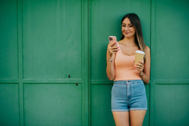 istock women using smart phone in city 1432774721