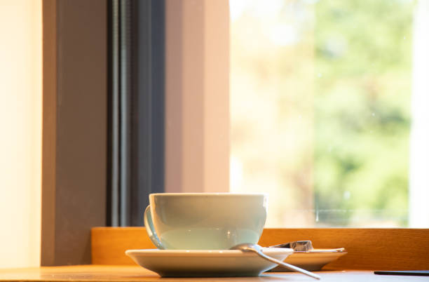 istock cup with coffee on a wooden table in a cafe, coffee 1432777044
