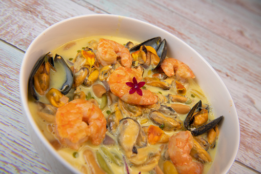 Recipe for marinated mussels with fresh cream, saffron curry and prawns, High quality photo