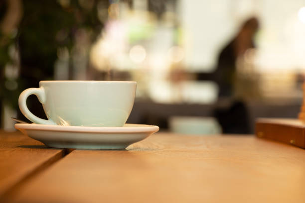 istock cup with coffee on a wooden table in a cafe, coffee 1432778188