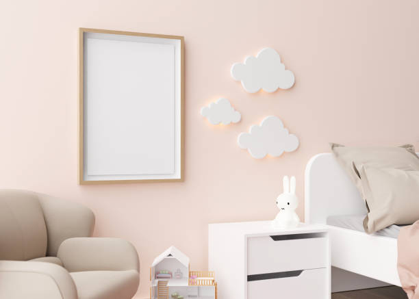 istock Empty vertical picture frame hanging on the wall in modern child room. Frame mock up in contemporary style. Free, copy space for picture, poster. Toys, bed, armchair. Close up view. 3D rendering. 1432778420