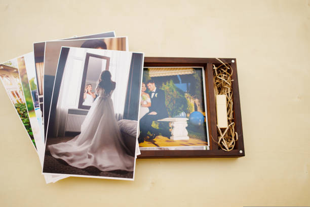 istock printed wedding photos and a wooden box with a flash drive. 1432779127