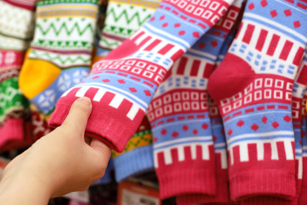 Woman choosing outfit and gifts for Christmas holidays