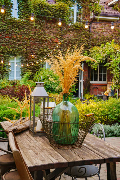 istock beautiful summer courtyard. wooden table with retro items. 1432781907