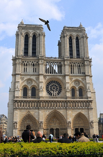 Paris, France- April 10, 2010: Paris is the center of French economy, politics and cultures and the top travel destinations in the globe.  It attracts the tourists all over the world.  Here is the Notre Dame de Paris.