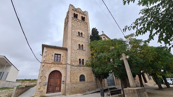 Vilobí del Penedès, Spain – October 10, 2022: Tower of Santa Maria de Vallformosa New Church in Vilobí del Penedès in Catalonia, Spain.