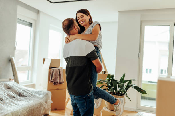 istock Lovely couple hugging at home 1432784533