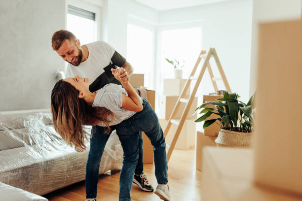 istock Joyful couple dancing at home. 1432784827