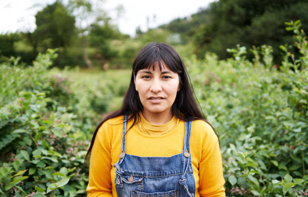 A young woman in an outdoors vegetable garden