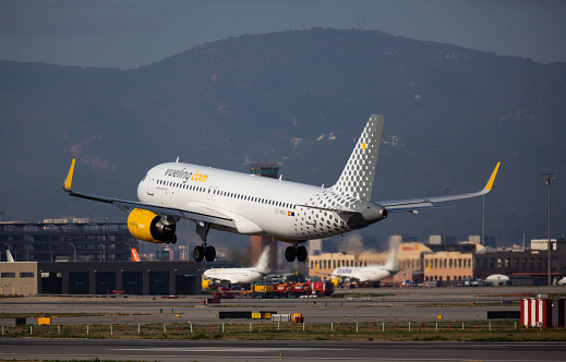 BARCELONA, SPAIN - JANUARY 26, 2020: View of EC-NEA Airbus A320neo of Vueling Airlines about to land at Barcelona Airport (BCN)