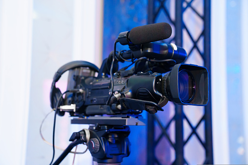 broadcast video camera to show what is happening on stage on large screens. professional equipment for the banquet.