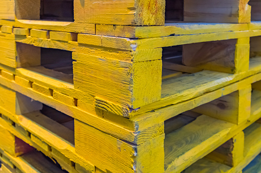 A range of wooden pallets. Inventory for shipment in the warehouse.