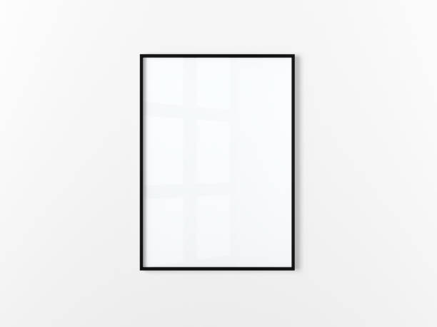 istock Blank frame. Poster mockup. Vertical frame hanging on a white wall. Isolated. Black. 1432793758
