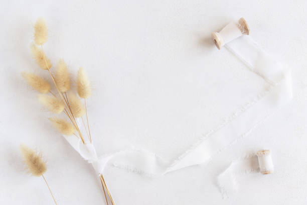 istock Hare's tail grass and silk ribbons on white top view, copy space. Romantic scene 1432795406