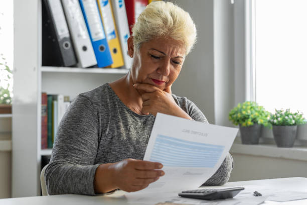 istock Mature woman having problems with her bills at home 1432796911