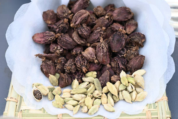 istock dried cardamom seeds on a bamboo plate. 1432797536